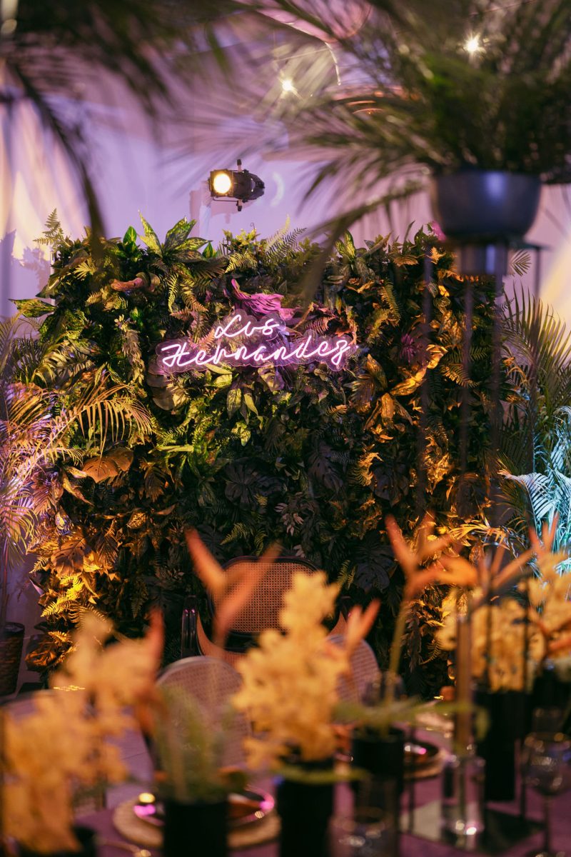 tropical photo-op with neon sign